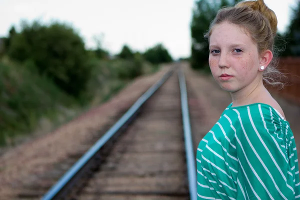 Young girl on railroad tracks. — Stock Photo, Image