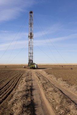Fracking Drilling in a Colorado farm field. clipart