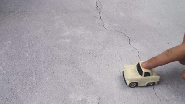 Finger Rolls Toy Car Shot Playing Concrete Surface Releases Car — Wideo stockowe