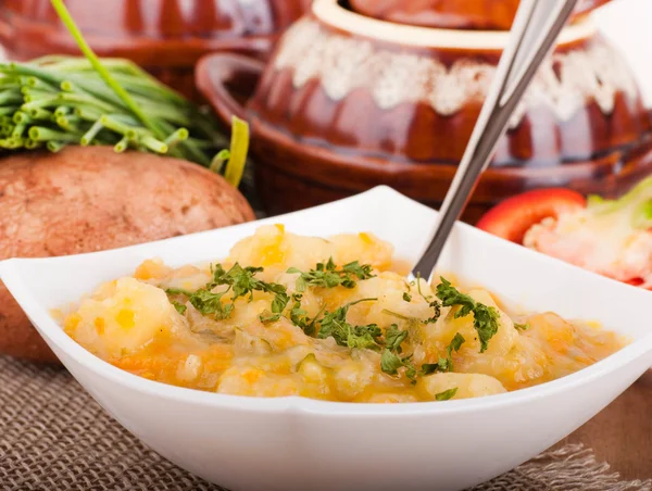 Potato with meat and mushrooms in a pot home-style — Stock Photo, Image