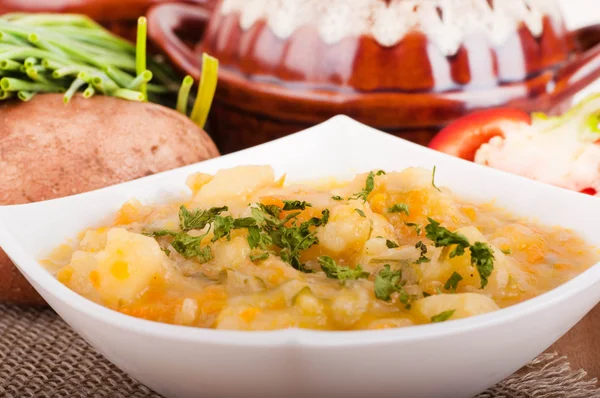 Potato with meat and mushrooms in a pot home-style — Stock Photo, Image