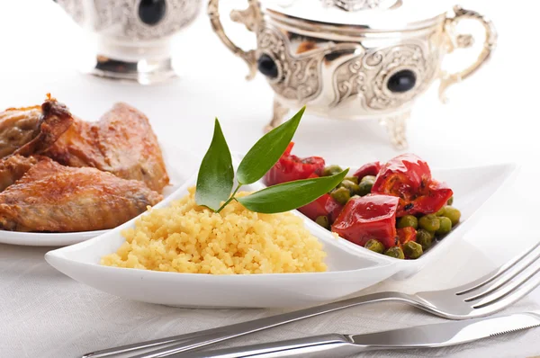 Couscous with green-stuffs and Arabic tableware — Stock Photo, Image