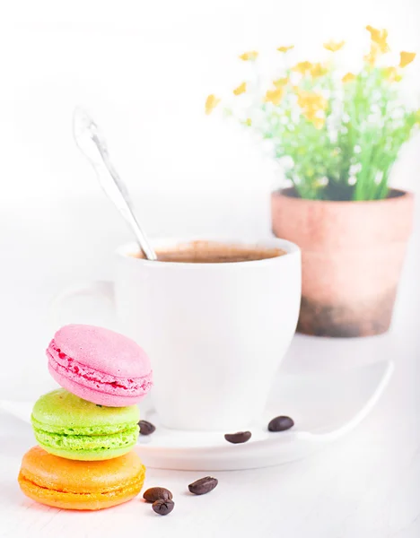 Multi-colored cakes and coffee on a white napkin — Stock Photo, Image