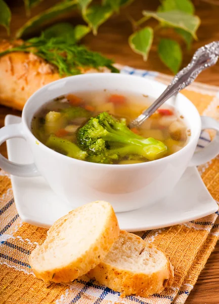 Vegetable broccoli soup and carrots, bread with fennel — Stock Photo, Image