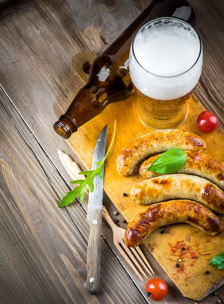 The Munich sausages with tomatoes and arugula — Stock Photo, Image