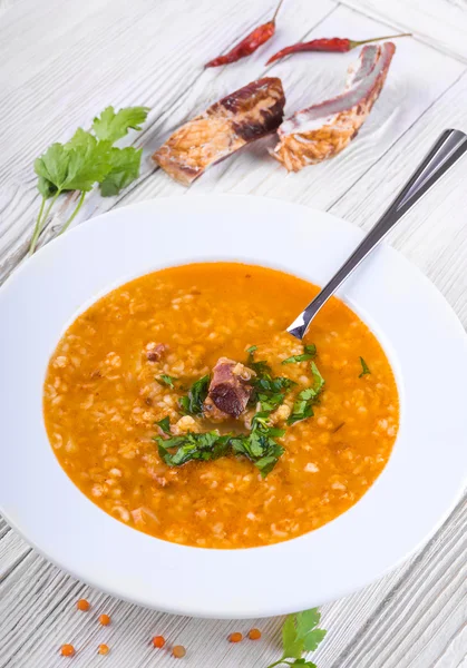 Soup on a wooden table — Stock Photo, Image