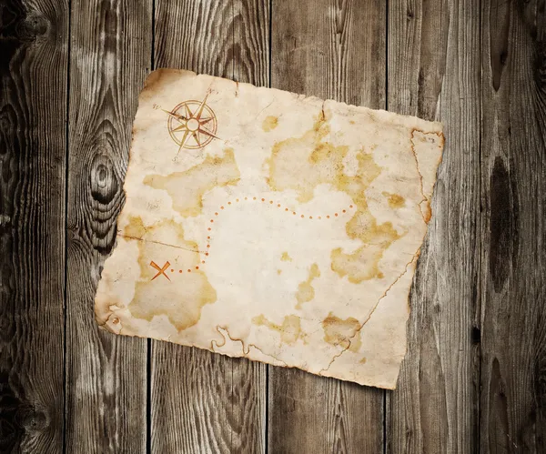 Viejo mapa del tesoro sobre fondo de madera — Foto de Stock