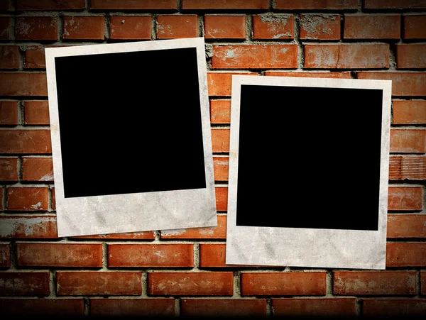 Photo frames on the brick wall — Stock Photo, Image