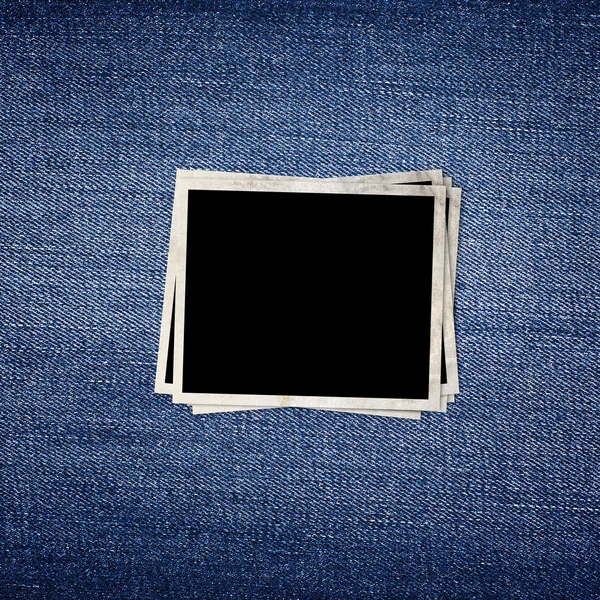 Vintage photo frame on blue jeans background — Stock Photo, Image