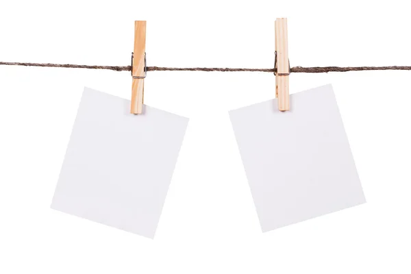 Blank instant photo hanging on the clothesline — Stock Photo, Image