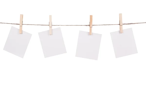 Blank instant photo hanging on the clothesline — Stock Photo, Image