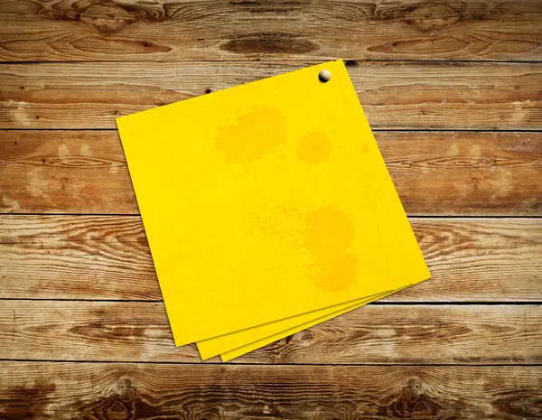 Yellow sticker paper note on vintage wood background — Stock Photo, Image