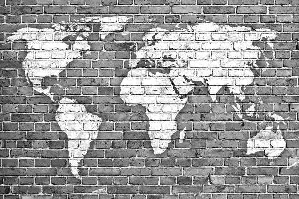 Weltkarte auf alter Ziegelmauer — Stockfoto