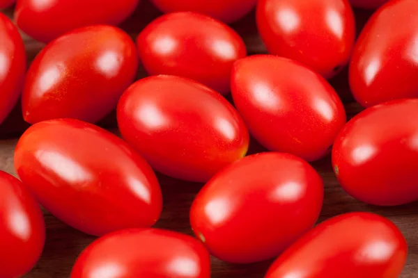 Fresh tomatoes on wood background — Stock Photo, Image
