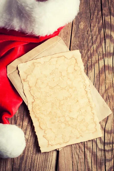 Vintage paper with Santa's hat — Stock Photo, Image