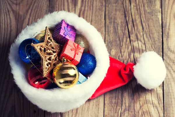 Christmas decoration in Santa's hat — Stock Photo, Image
