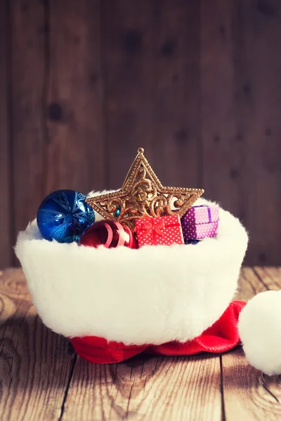 Christmas decoration in Santa's hat — Stock Photo, Image