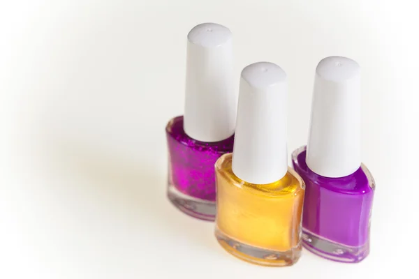 Purple and gold nail polish — Stock Photo, Image