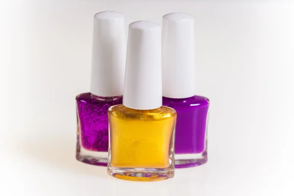 Purple and gold nail polish — Stock Photo, Image