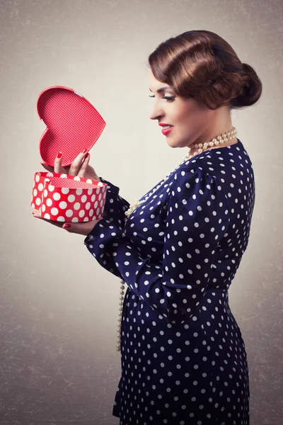 Woman with heart-shaped box — Stock Photo, Image