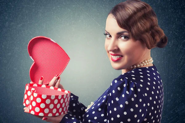 Woman with heart-shaped box — Stock Photo, Image