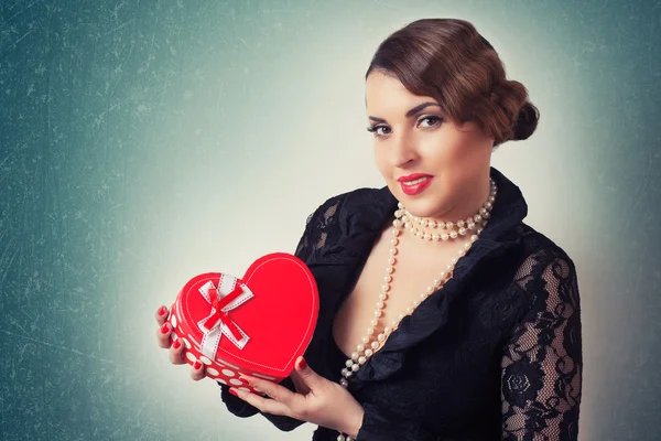 Woman with heart-shaped box — Stock Photo, Image