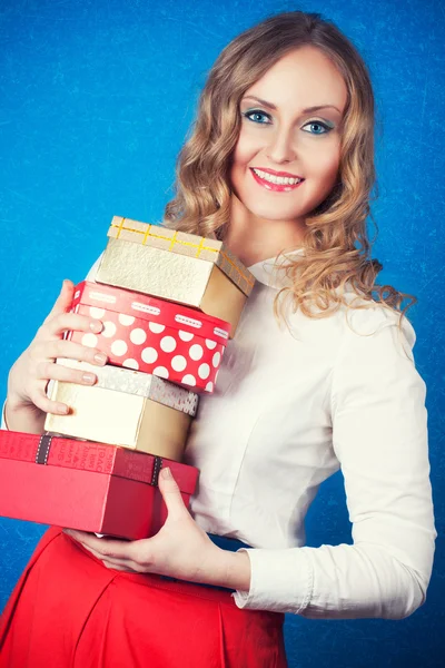 Woman with a gift boxes — Stock Photo, Image
