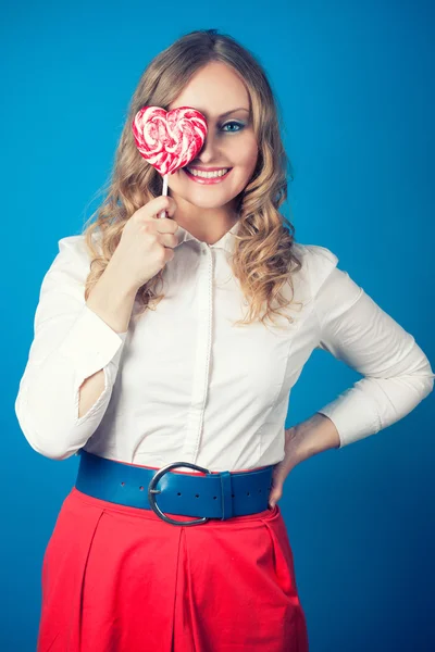 Beautiful young woman with lollipop — Stock Photo, Image