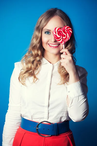 Beautiful young woman with lollipop — Stock Photo, Image