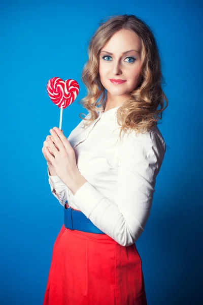 Beautiful young woman with lollipop — Stock Photo, Image