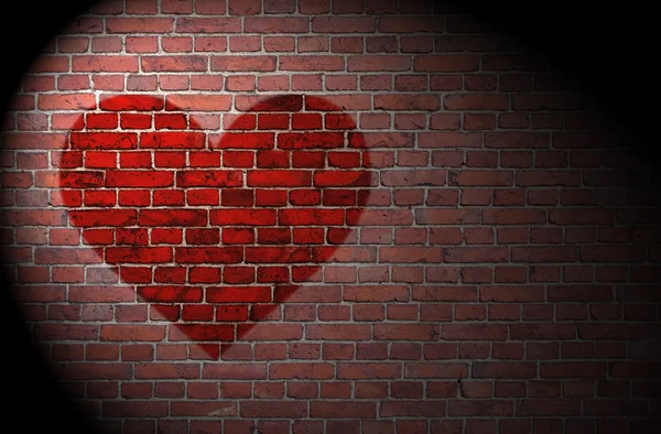 Rødt hjerte på væggen - Stock-foto