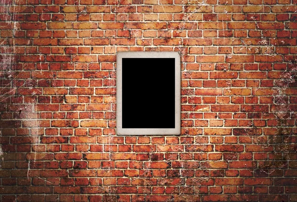 Black frame on brick wall — Stock Photo, Image