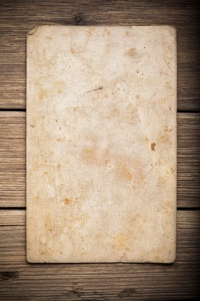 Old paper on the wood background — Stock Photo, Image
