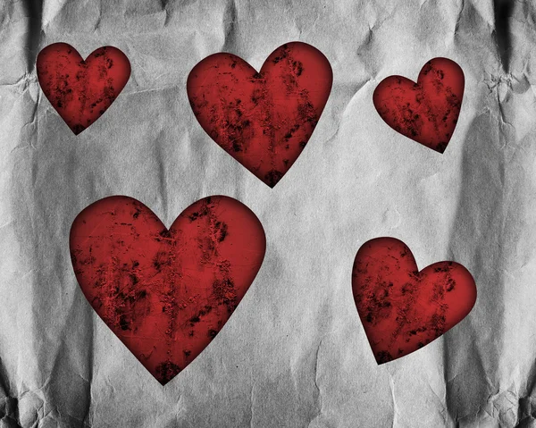 Красные сердца на бумаге — стоковое фото