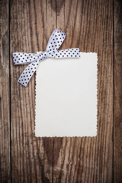 Blank paper sheet with bow — Stock Photo, Image