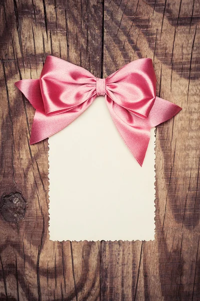 Paper sheet with bow — Stock Photo, Image