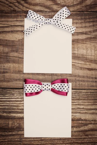 Paper sheets with bows — Stock Photo, Image