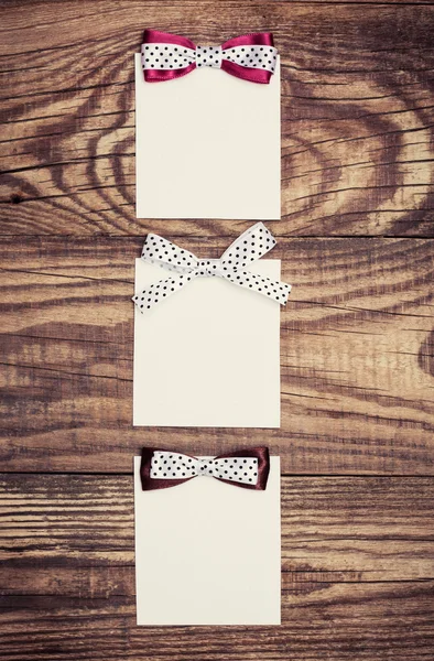 Paper sheets with bows — Stock Photo, Image