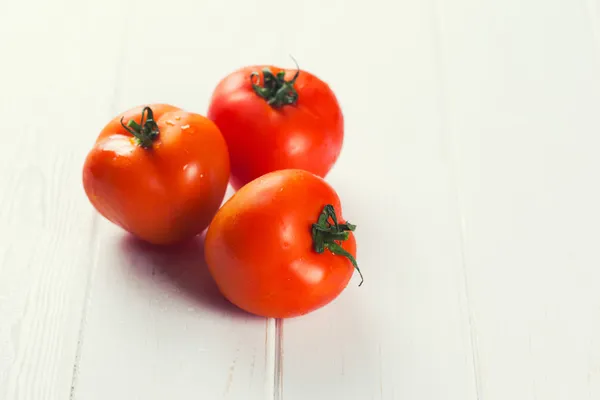 Tomatoes on  table — Stock Photo, Image