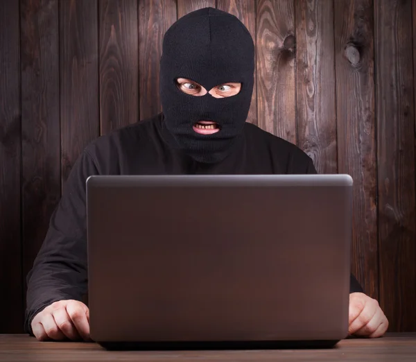 Hacker in a balaclava — Stock Photo, Image