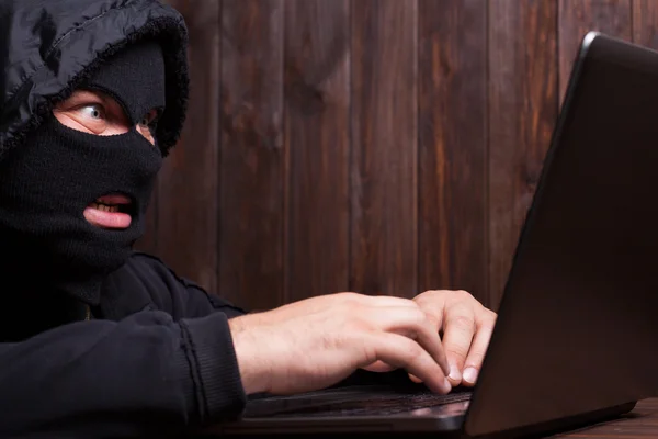 Hacker in a balaclava — Stock Photo, Image