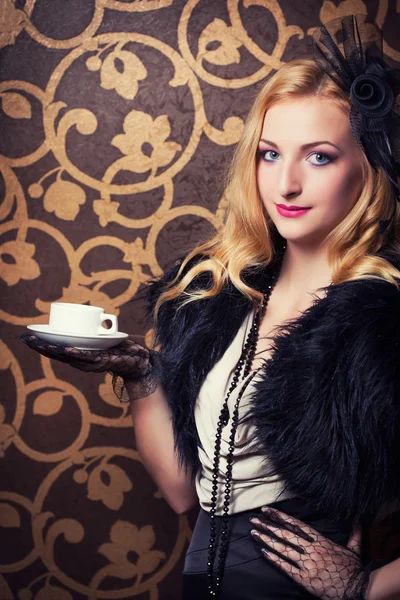 Retro woman drinking coffee Royalty Free Stock Photos