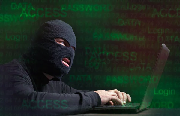 Hacker in a balaclava — Stock Photo, Image