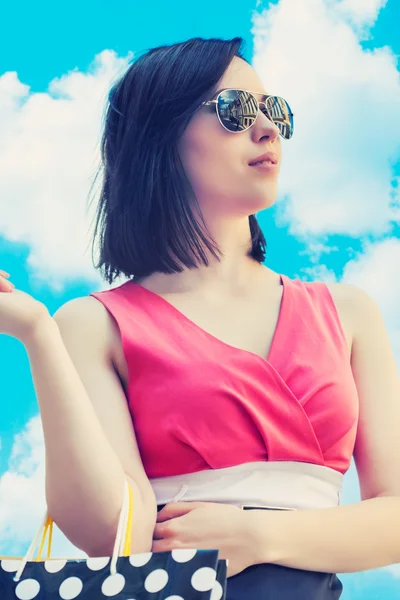 Woman holding shopping bags — Stock Photo, Image