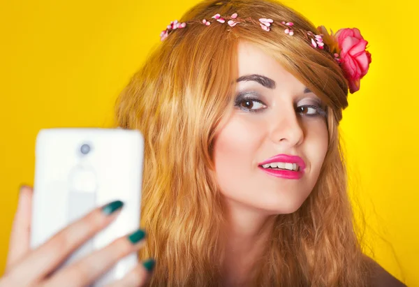 Woman making selfie using smartphone — Stock Photo, Image