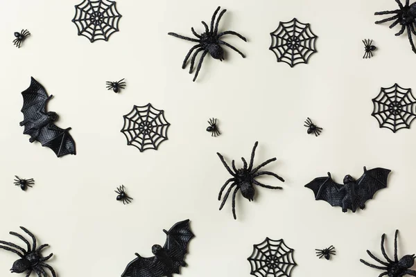 Happy Halloween, trick or treat greeting card with bats, spiderweb and spider. Flat lay composition