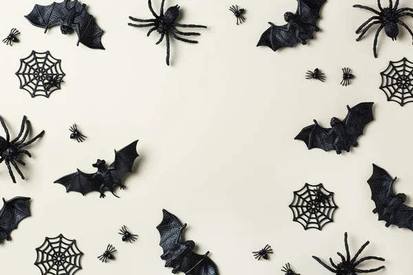 Happy Halloween, trick or treat greeting card with bats, spiderweb and spider. Flat lay composition, copy space mockup template
