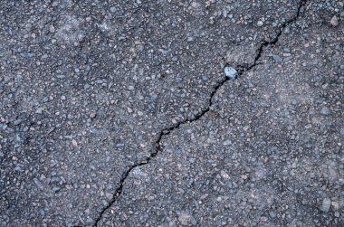 Black road background or texture, Asphalt .Large cracking crack on asphalt road.