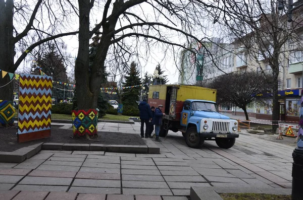 Rivne. Ukraine. November, 2021.municipal blue red yellow color ussr old electric service and water supply repair GAZ 53, vintage classic car arriving on emergency call drive on city urban street