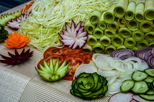 Variety of carving vegetables .Fruit and vegetable carving . Food decoration. Vegetable flowers